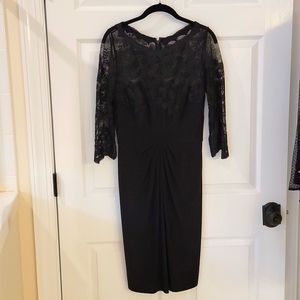 Monique Lhuillier black midi dress with lace detail.